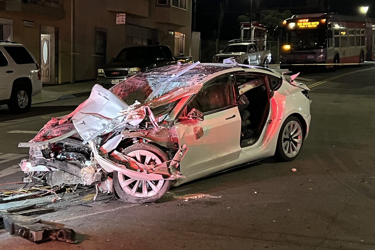 after-a-tesla-crashes-and-catches-fire-in-downtown-toronto,-the-driver-is-arrested